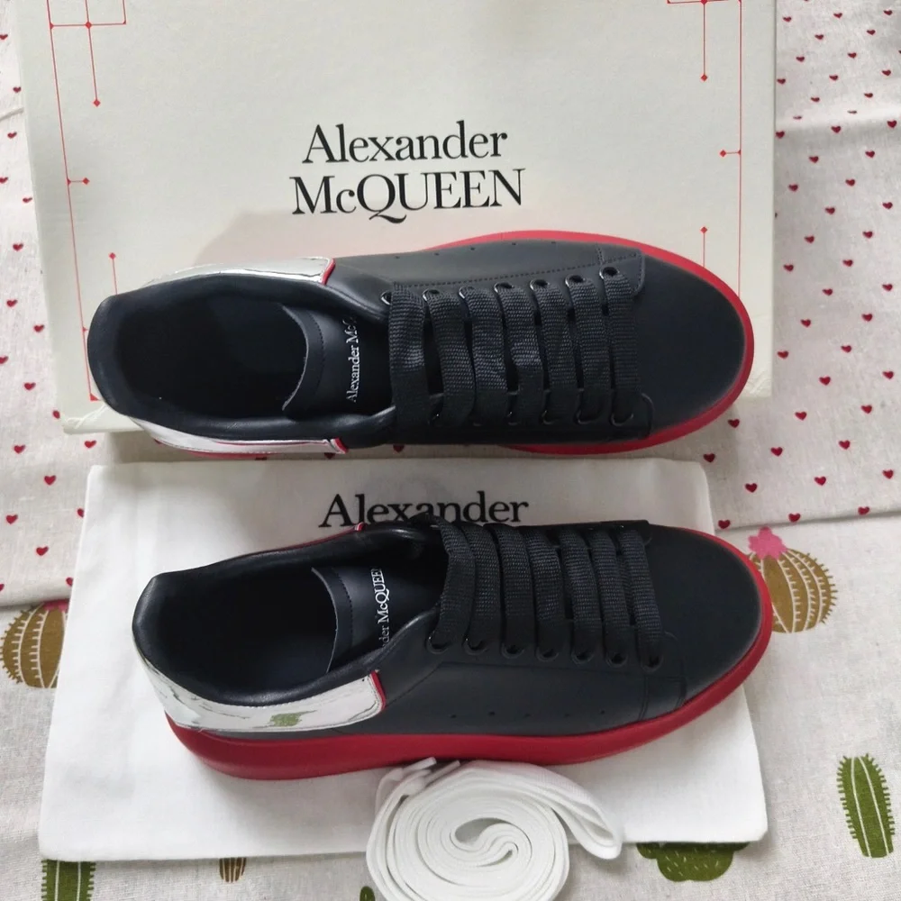 Alexander McQueen Black Leather Sneakers with Red Soles